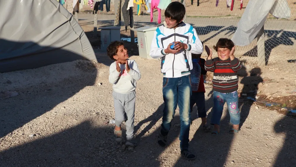 Syrian Kurds who fled to a refugee camp during the country's civil war.  Shutterstock