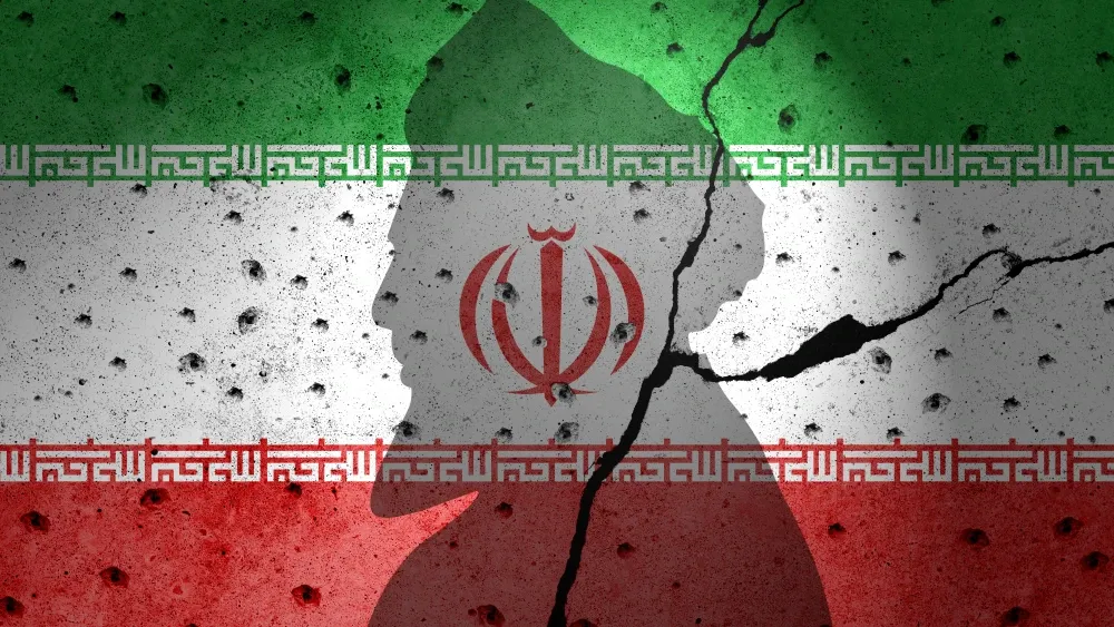 The flag of the Islamic Republic on a cracked wall.  Shutterstock