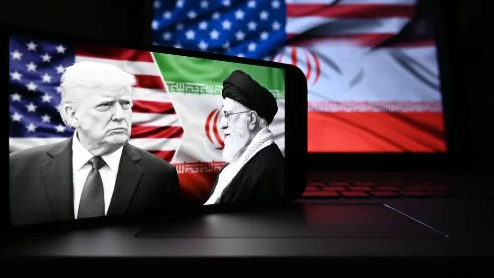 President Donald Trump and Iran's Supreme Leader Ali Khamenei are pictured on a smartphone.  Shutterstock