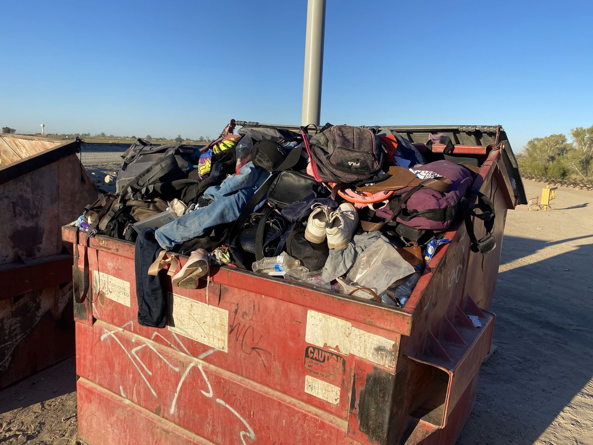 Dumpster filled with the personal belongings of migrants