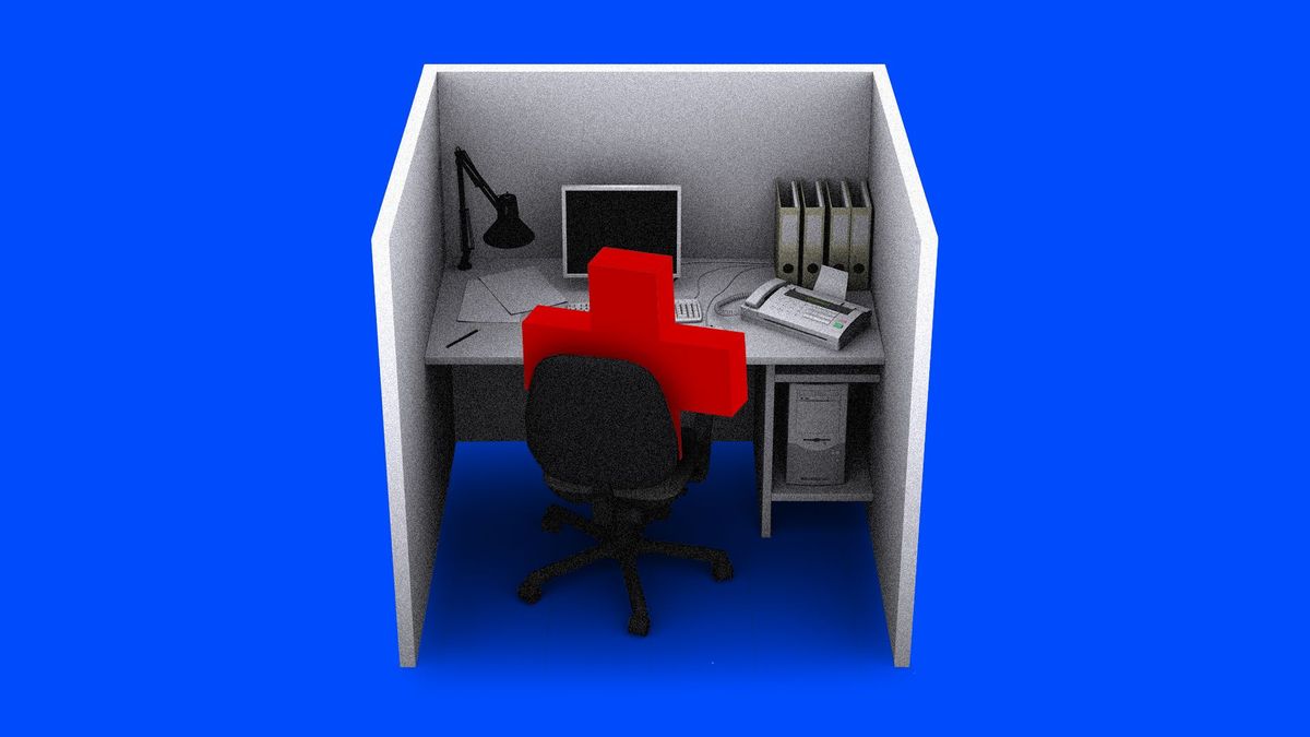 A red cross in a chair in a cubicle
