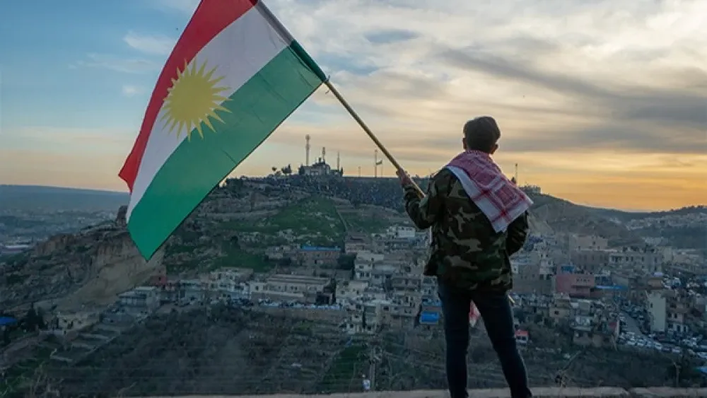 Man waving Kurdistan flag