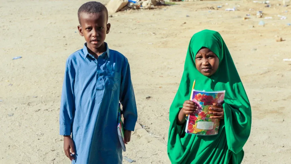 Children carry school supplies in Somaliland.  Shutterstock