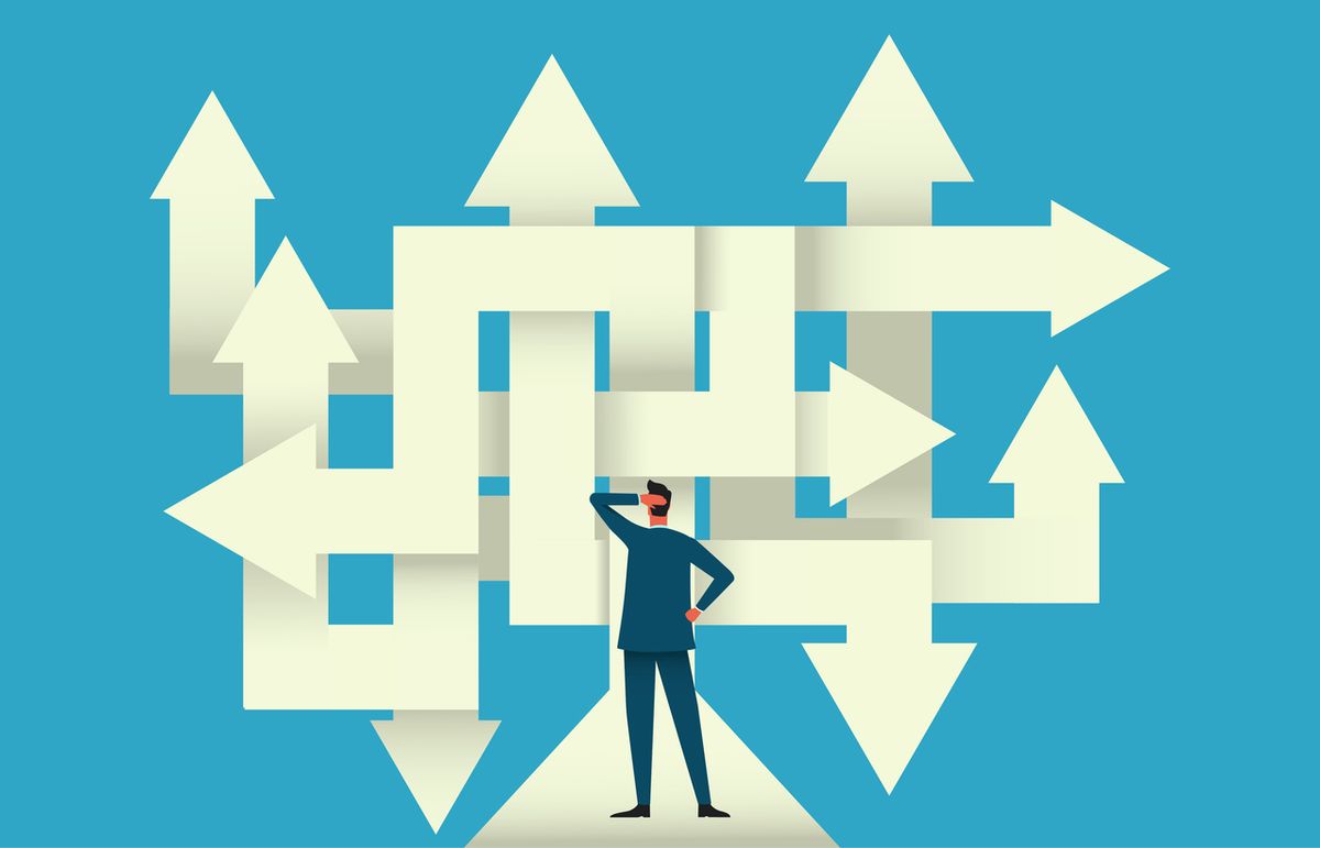 Person in front of many arrows going in different directions
