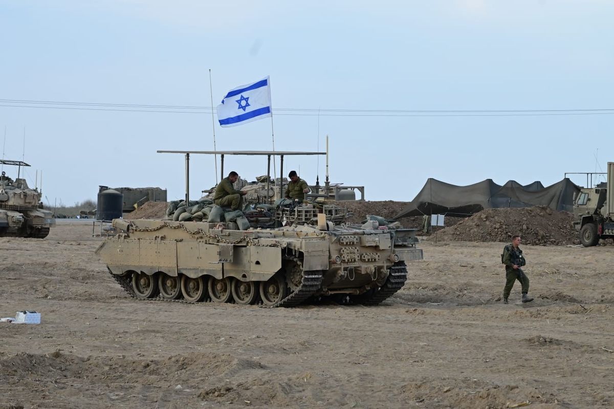 Israeli soldiers wait on the Gaza border.
