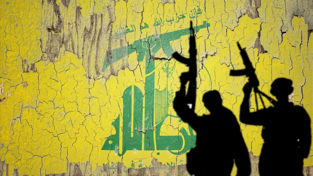 The flag of Hezbollah painted on a cracked wall.  Shutterstock