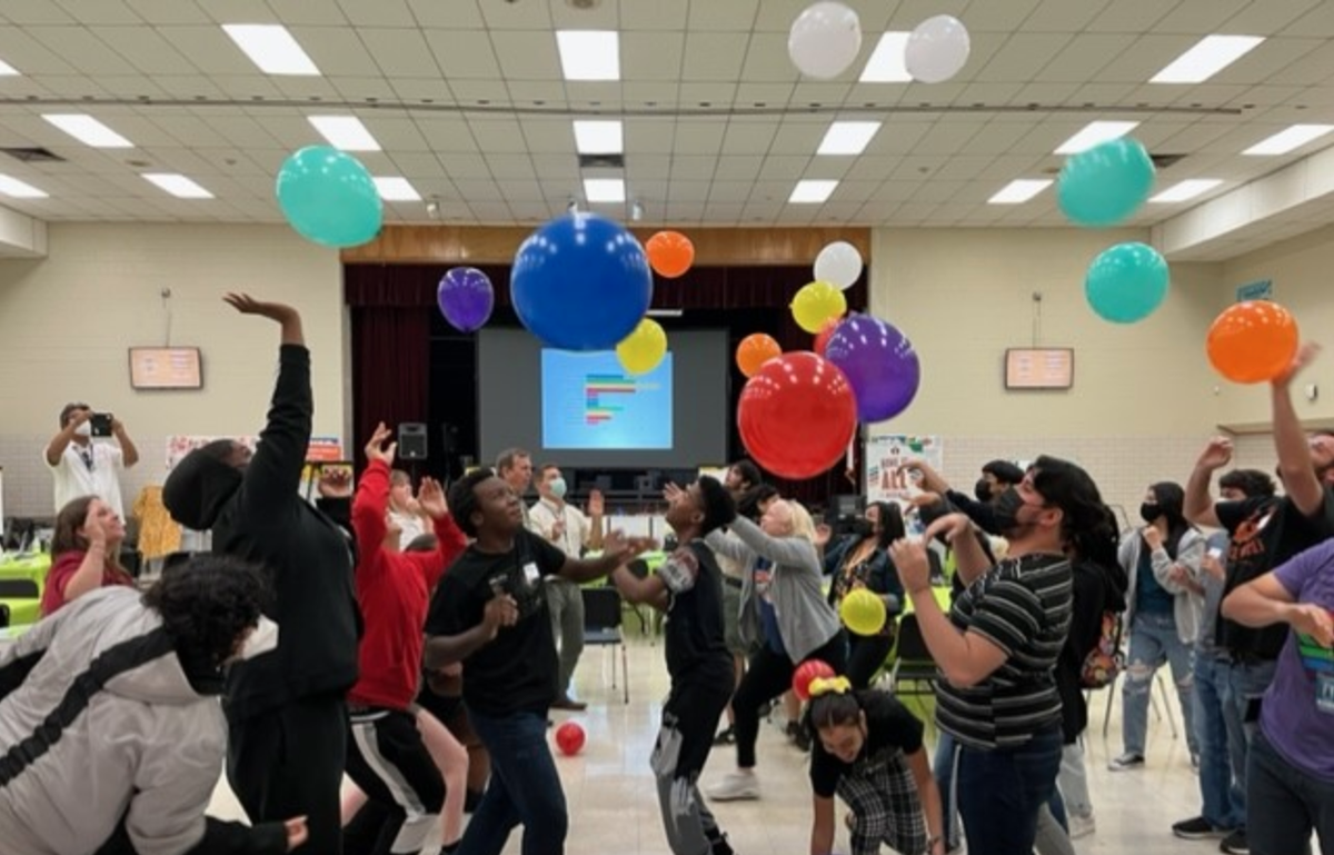 Student Equity Council playing with balloons.