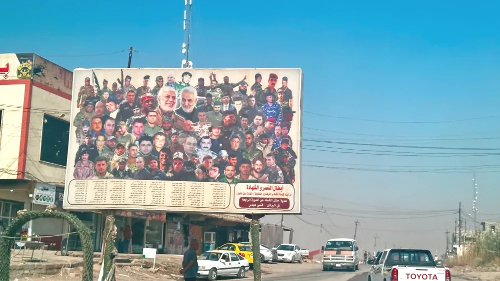 Billboard of Iran-backed militia members on billboard, including the late Qasem Suleimani. Mosul, Iraq October 30, 2024.  Shutterstock