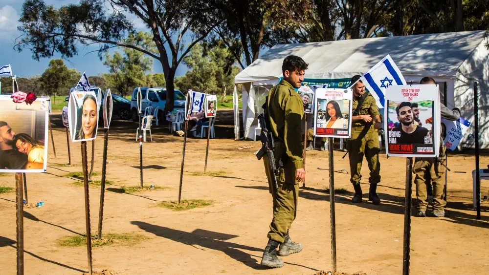 On Jan. 5, 2024, Israeli soldiers gather to pay tribute to attendees of the NOVA festival who were massacred by Hamas on Oct. 7, 2023.  Shutterstock