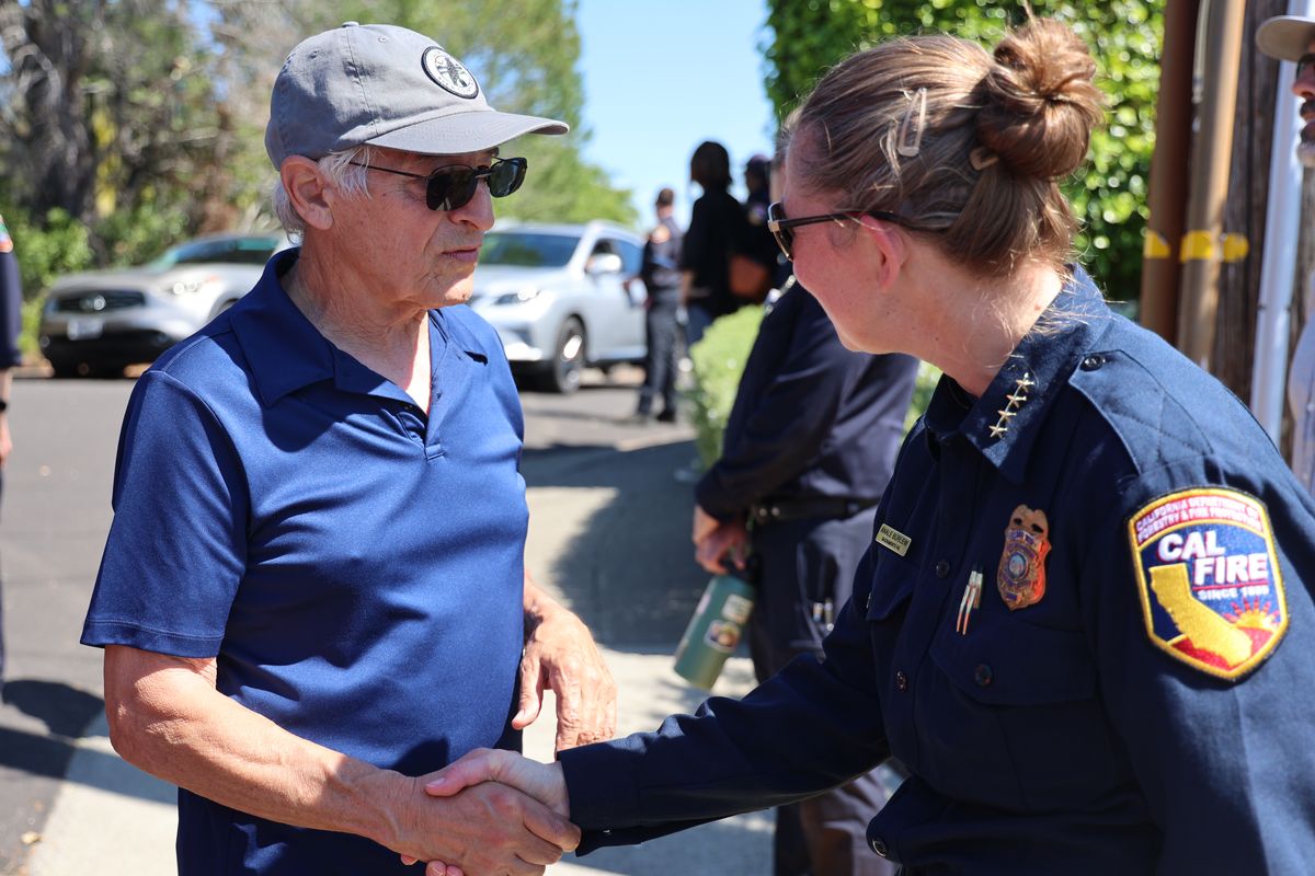 CAL FIRE staff shaking hands with a community member