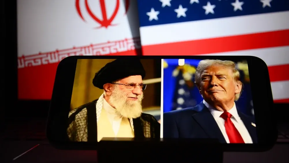 Iran's Supreme Leader Ali Khamenei and U.S. President Donald Trump in a smartphone split-screen.  Shutterstock