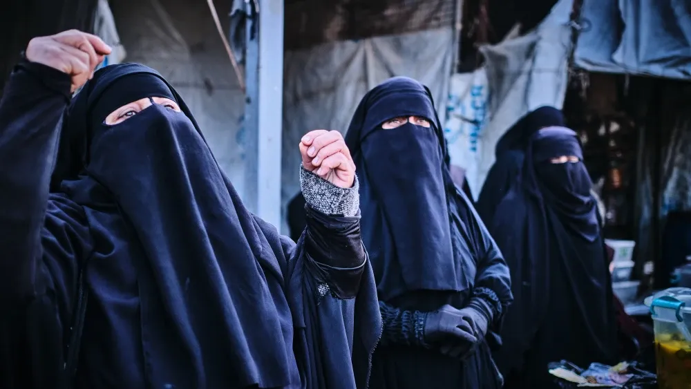 Three women wear niqabs in Al-Hol refugee camp, Syria, on Dec. 20, 2022. There is a significant danger that the more than 40,000 Islamic State veterans and their families under Kurdish guard at Al-Hol...
