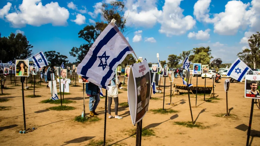 A memorial composed of photos of young Israelis killed during the terrorist attack on the NOVA Festival on October 7, 2023.  Shutterstock