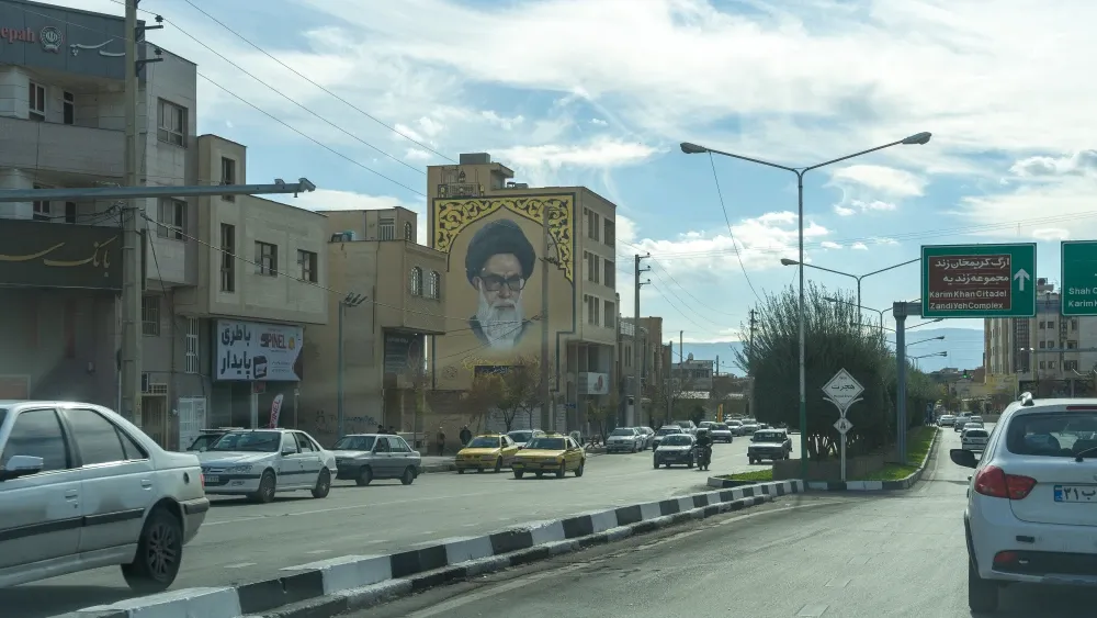 An image of Ayatollah Ruhollah Khomeini looms over a street in Shiraz, Iran.  Shutterstock