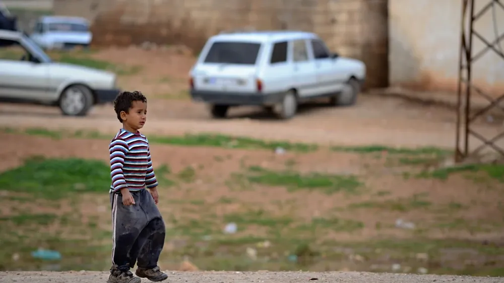 A Kurdish boy walks the streets of Kobane, Syria, in a file photo.  Shutterstock
