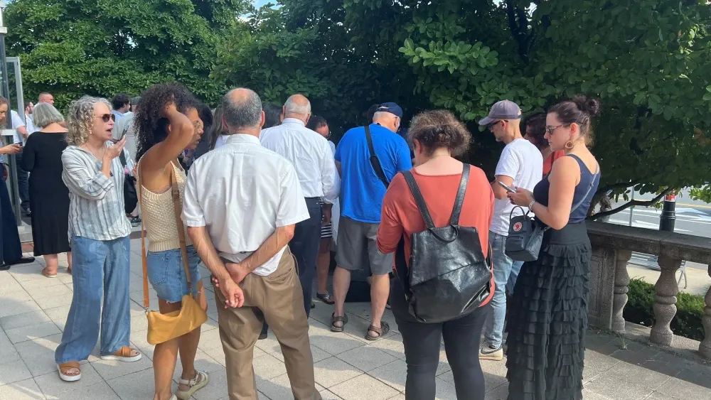 Individuals gathered in Newton, MA.