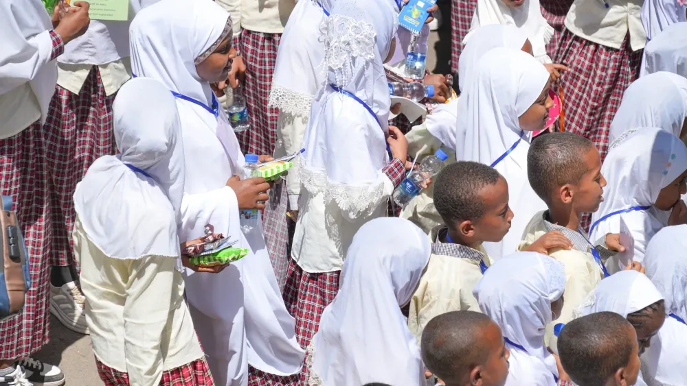 Students line up as they await the start of afternoon classes in Addis Ababa, Ethiopia.  Shutterstock