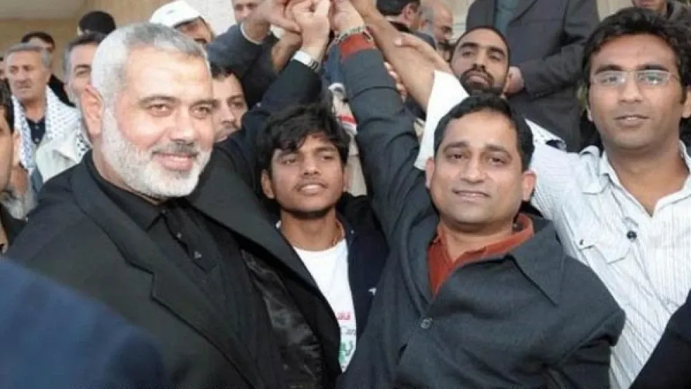 A picture of Georgetown academic Badar Khan Suri (far right) celebrating with Hamas leader Ismail Haniyeh (left). Source: www.camera.org/article/politico-runs-cover-for-hamasniks-at-georgetown/