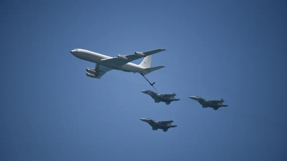 An Israeli Air Force Boeing 707 tanker demonstrates mid-air refueling with F-15s