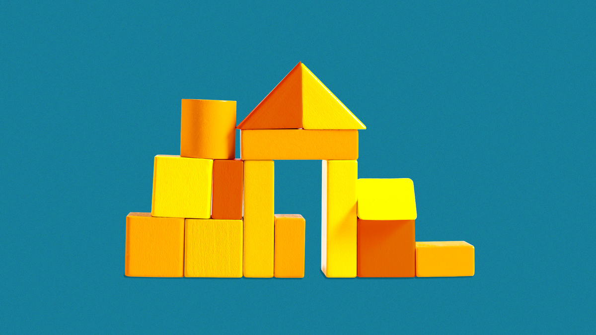 Blocks arranged in the shape of a house.