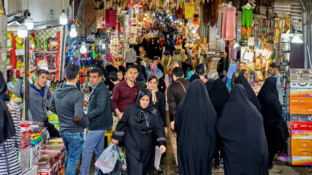 People mingle in a bazaar in Tehran, Iran. Shutterstock
