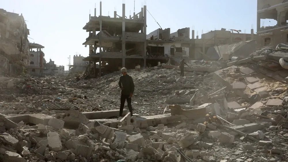 People wander in the ruins of Gaza. Shutterstock
