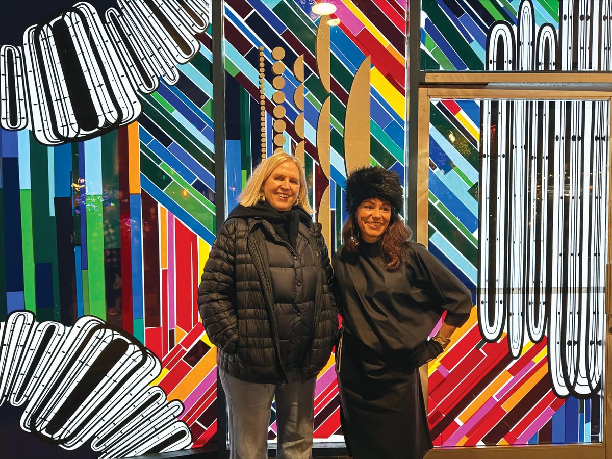 CELEBRATE Art Works Downtown executive director Elisabeth Setten (left) and artist Raylene Gorum recently attended an opening reception for Gorum’s ‘Civic Wave’ installation.