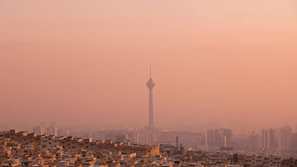 Air pollution at sunset casts a pink glow around Tehran, Iran, the most polluted city in the world.  Shutterstock