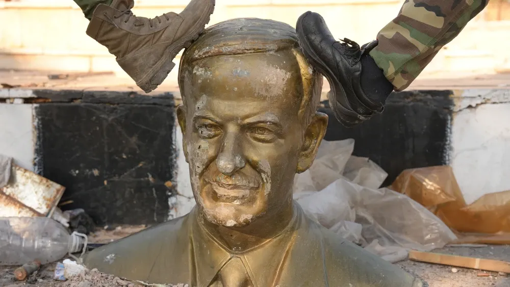 Boots on assad statue