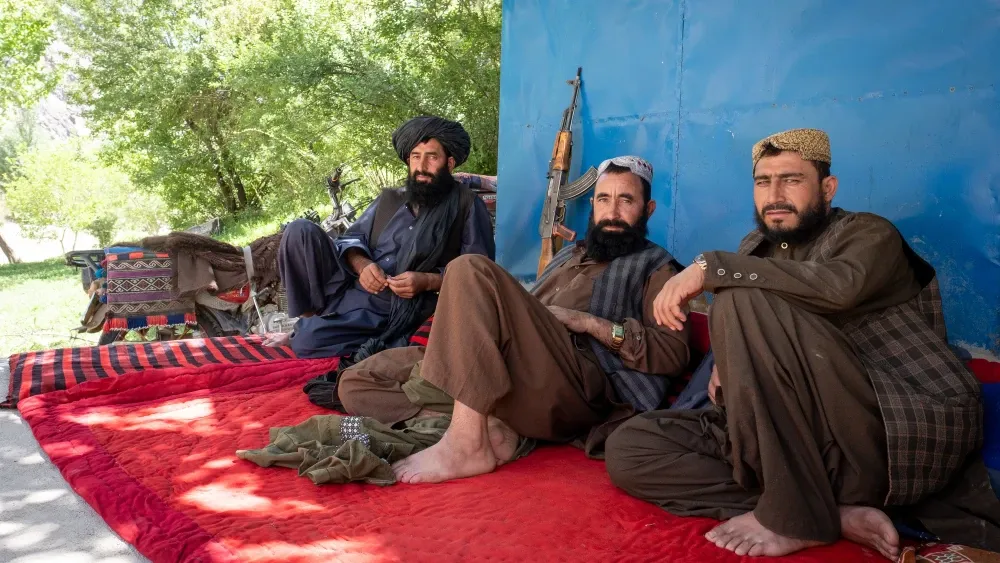 Taliban fighters rest in Jam, Afghanistan.  Shutterstock
