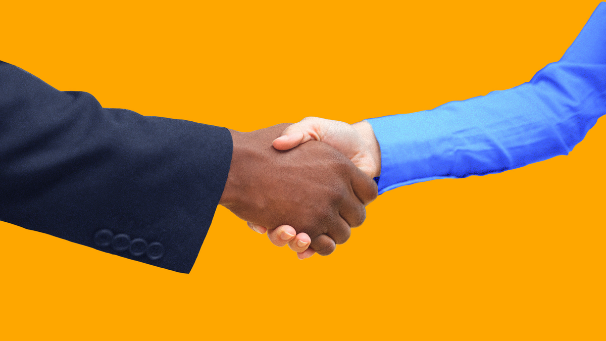 A handshake between two hands.