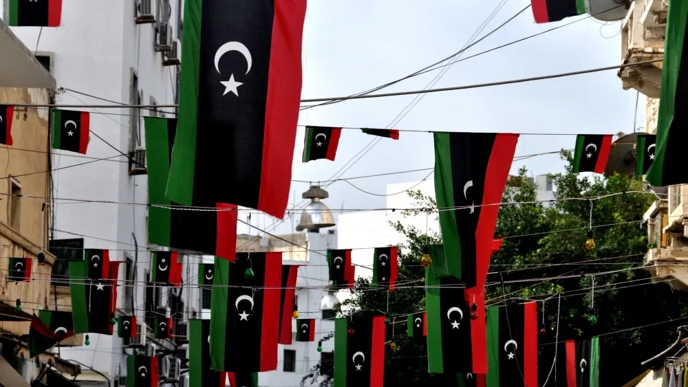 The United States and its allies must move with the same urgency and strategic clarity that Russia is demonstrating. Libyan flags in Tripoli, Libya.  Shutterstock