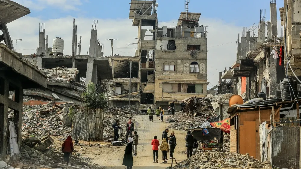 Palestinians return to their homes in Khan Younis in the southern Gaza Strip, on February 11, 2025.  Shutterstock