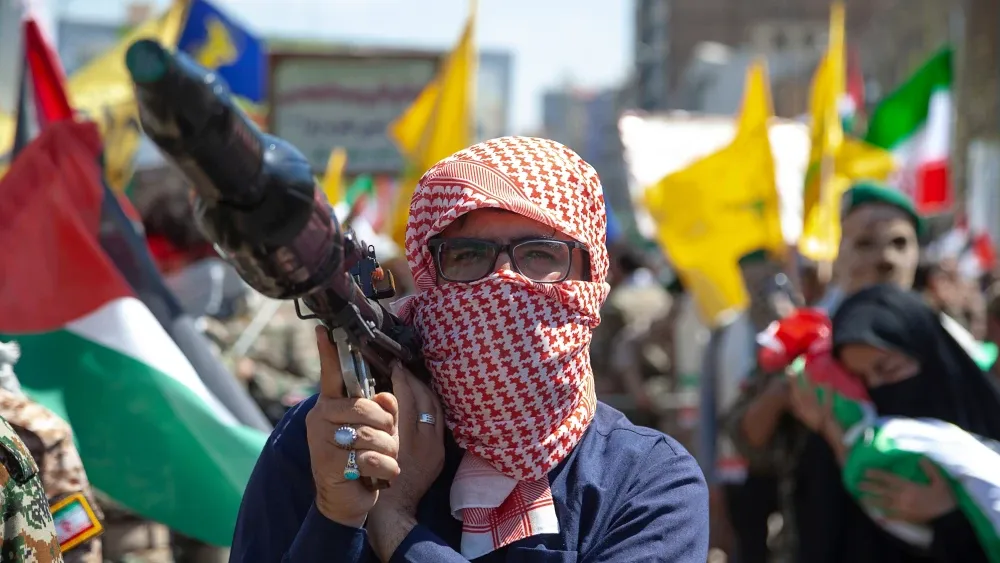 A Palestinian man holds an RPG in Tehran, Iran, on International Quds Day on April 5, 2024.  Shutterstock