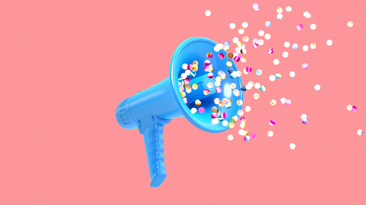 Confetti flying out of a megaphone.
