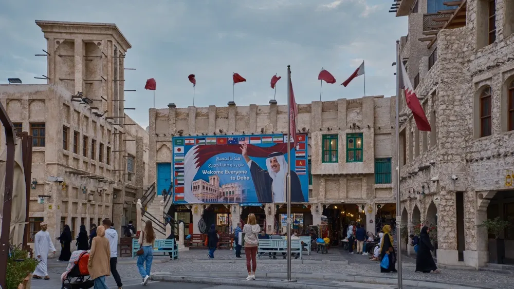The Souq Waqif marketplace in Doha, Qatar, features a billboard with Sheikh Tamim bin Hamad Al Thani, the emir. Shutterstock