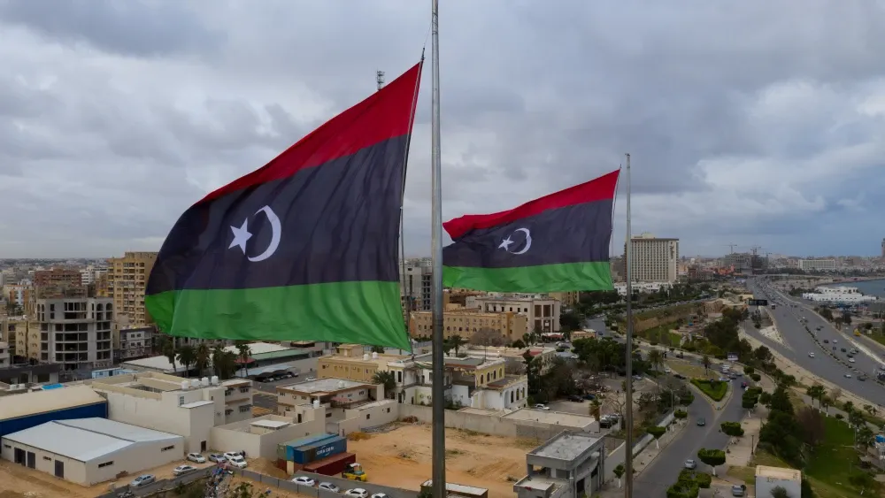 Libyan flags fly over Tripoli, the country’s capital city. Shutterstock