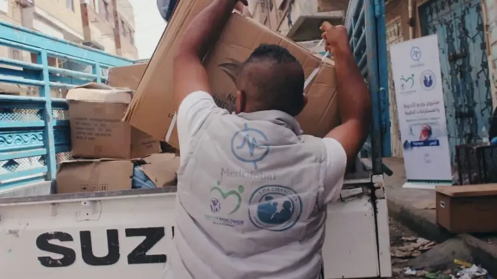 An aid worker's jacket, emblazoned with the logos of the Latter-day Saint Charities and the terror-aligned Michigan charity Rahma Worldwide, which signed contracts with senior Hamas terror officials i...