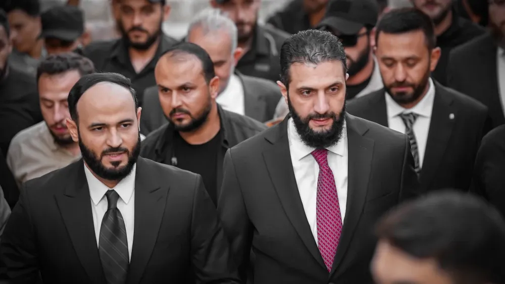 Syrian President Ahmed al-Sharaa (center right) in May 2025. Shutterstock