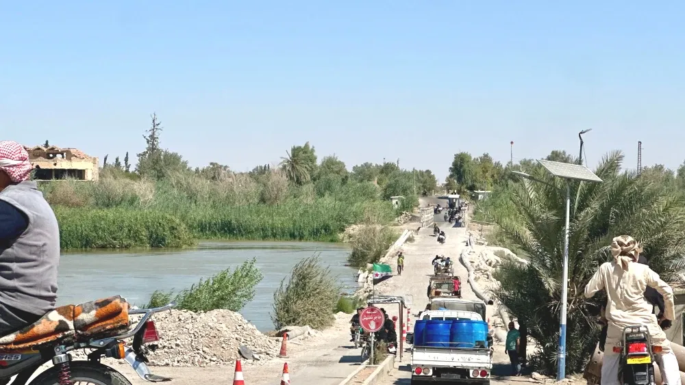 The government's campaign against the Syrian Democratic Forces (SDF) has moved fast. The government army has swept through Arab-majority Deir al-Zur and Raqqa provinces. Above: a makeshift dirt bridge...
