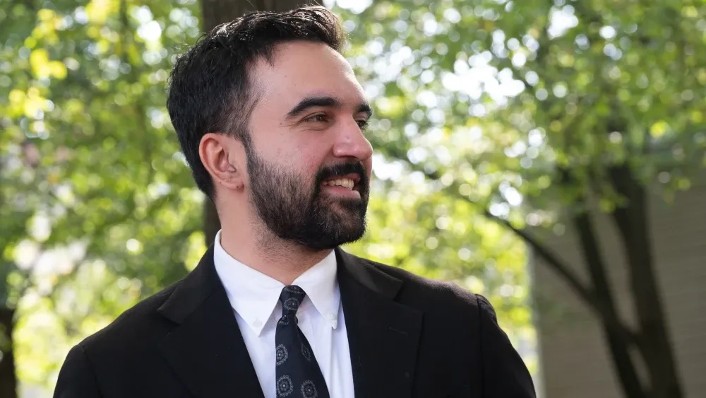 New York City mayoral candidate Zohran Mamdani attends canvassing ahead of the vote Queens Borough on October 19, 2025.  Shutterstock