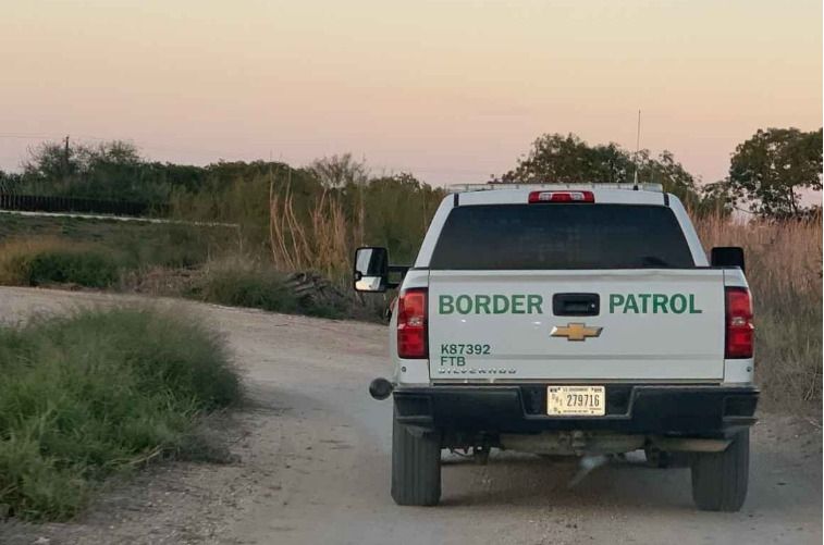 Photo of a border patrol vehicle on a road.