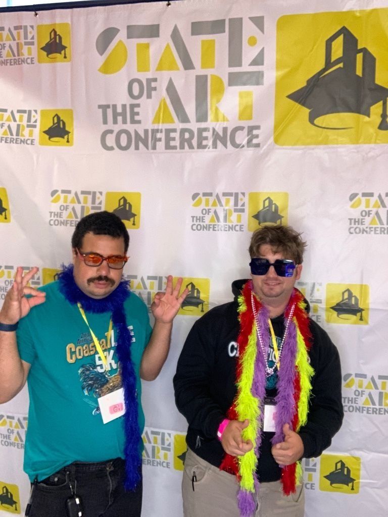 Bo and Franc posing at the annual State of the Art national conference.
