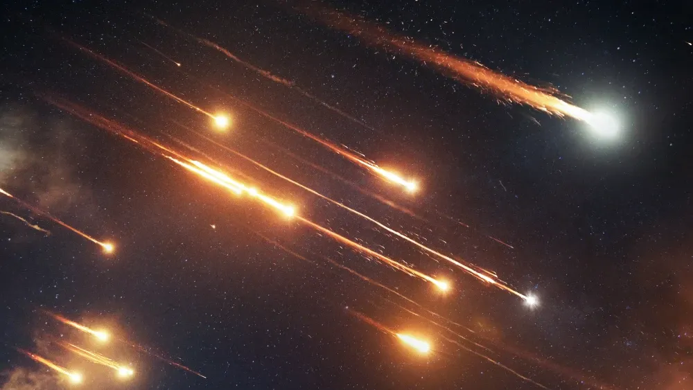 Ballistic missiles soar into the night sky.  Shutterstock