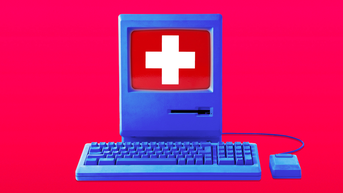 A computer displaying a healthcare symbol.