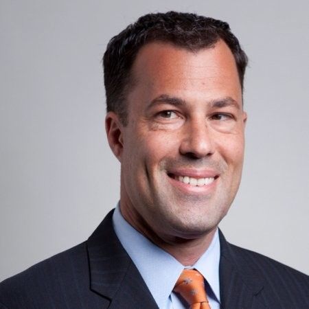 Headshot of man in suit