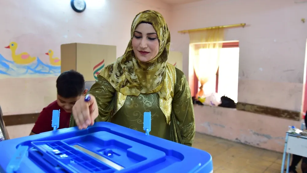 A woman casts her vote in Erbil, the capital of Iraqi Kurdistan.