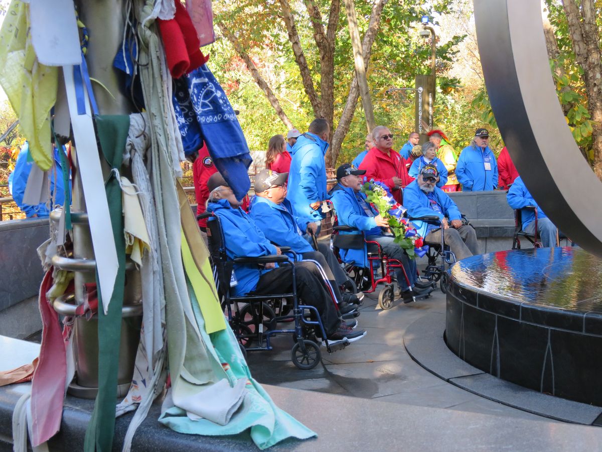 Pictured: Individuals wearing blue coats signify Native veterans who have served in the military.