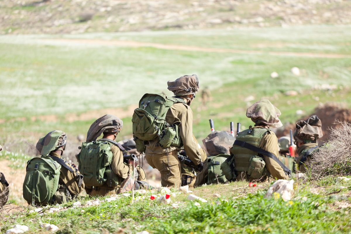 Israeli soldiers prepare to invade Gaza.