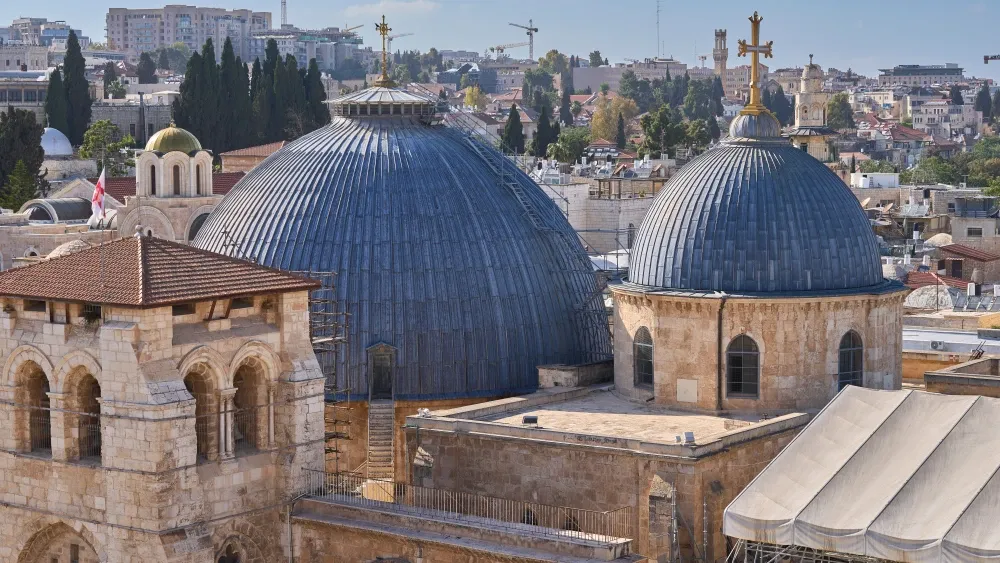 The gray domes of the Church of the Holy Sepulchre in the Christian Quarter of the Old City of Jerusalem, the holiest site in Christianity.  Shutterstock
